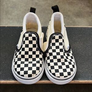 Vans Black and White Checkerboard Slip-On Sneakers